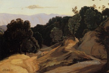 ジャン・バティスト・カミーユ・コロー Painting - 樹木に覆われた山々を通る道 外光 ロマン主義 ジャン・バティスト・カミーユ・コロー